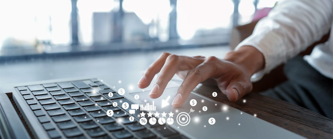 Image of a person typing on a keyboard with digital icons floating